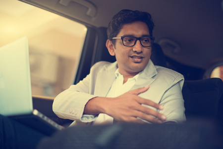 indian business male with business handshake inside the carの写真素材