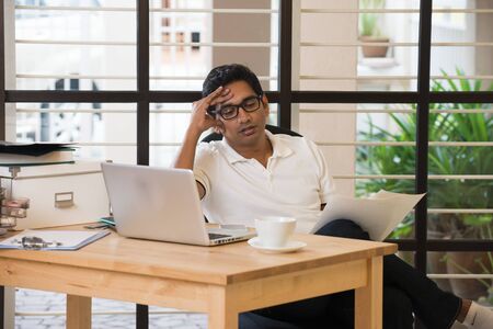 indian male having headache