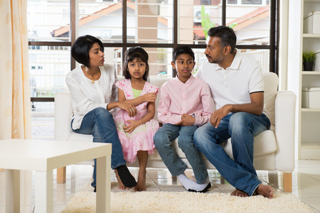 happy indian family at living roomの写真素材