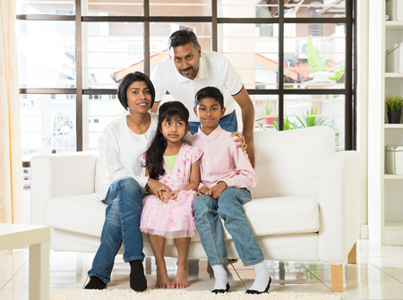 happy indian family at living roomの写真素材