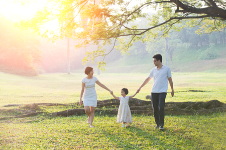 Happy Asian Family enjoying family time together in the park

の写真素材