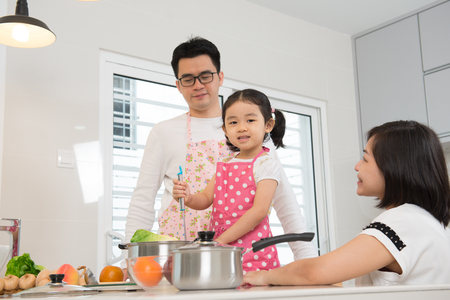 asian family cooking at kitchenの写真素材