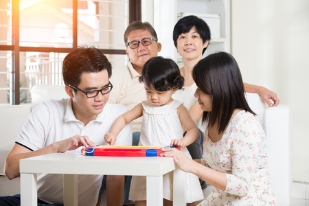 multi generation asian family at homeの写真素材