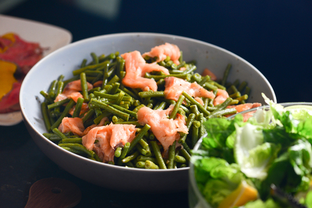 Salads in individual containers displayed on a buffetの写真素材