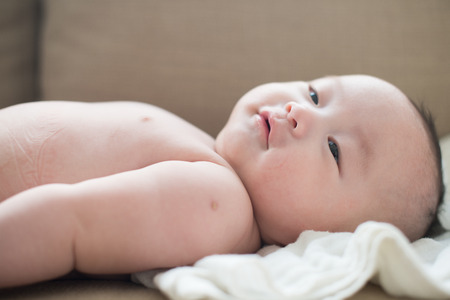 cute looking asian baby boyの写真素材