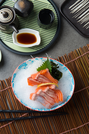 fresh salmon shashimi sushi on fresh iceの写真素材