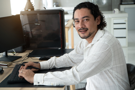 casual persian man working from homeの写真素材