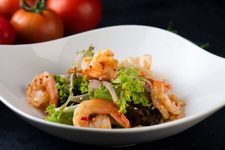 Fresh salad plate with shrimp, tomato and mixed greensの写真素材