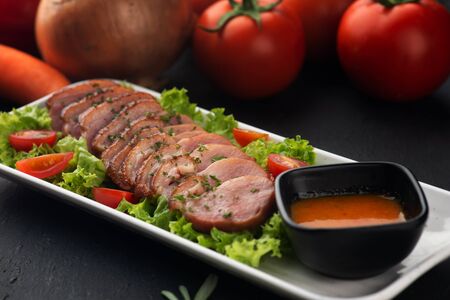 smoked duck with chilli sauce and saladの写真素材