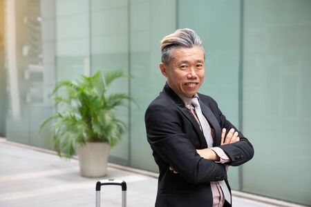 asian senior business male with office backgroundの写真素材