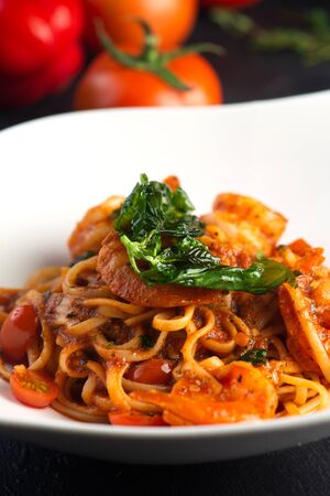 Pasta with meat, tomato sauce and vegetablesの写真素材