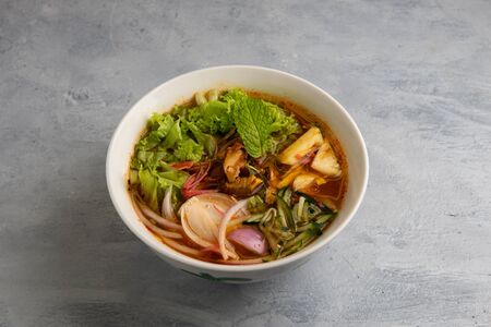 laksa noodle soup with grey backgroundの写真素材