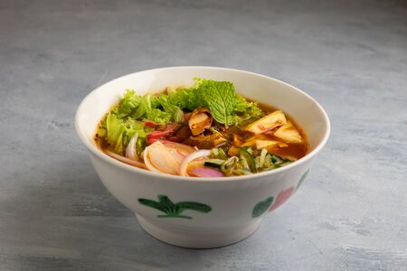 laksa noodle soup with grey backgroundの写真素材