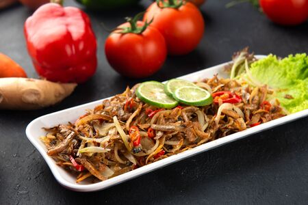Stir-fried anchovy with sambal and chilli, traditional malay foodの写真素材