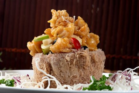 chinese crispy yam ring basket with sweet & sour prawnsの写真素材