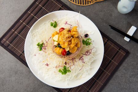 chinese crispy yam ring basket with sweet & sour prawnsの写真素材