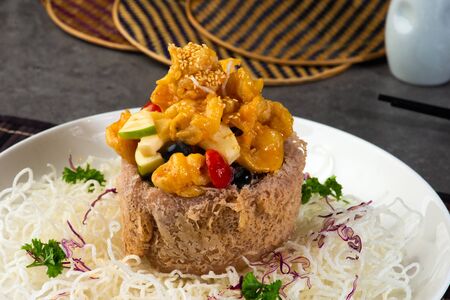 chinese crispy yam ring basket with sweet & sour prawnsの写真素材