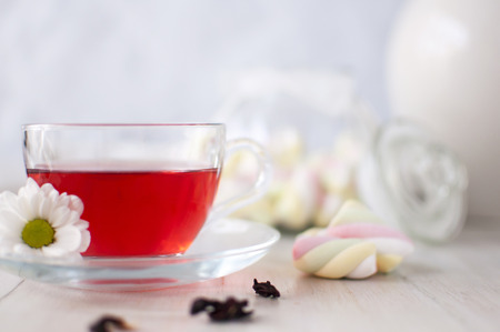 Tea with petals karkade. Delicious and healthy drinkの写真素材
