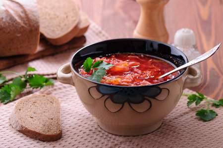 Delicious vegetable soup from cabbage and beet. Borscht.