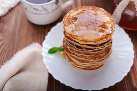 Pancakes for breakfast with honey, American pancakes.