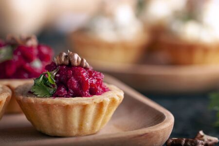 Tartlets with beetroot filling and nuts.の写真素材
