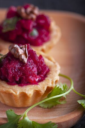 Tartlets with beetroot filling and nuts.の写真素材