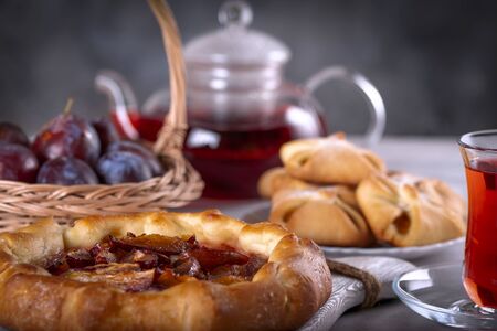 A beautiful open pie with plums. Seasonal baking. Pie for tea.の写真素材