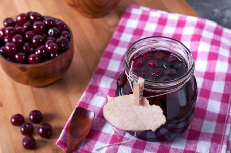 Cherry jam for breakfast. Cooking jam in the summer season. Cooking, preserving berries.の写真素材