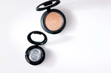 Beautiful eye shadow with sparkles, in a black single jar. The shadows are glossy, cream.の写真素材