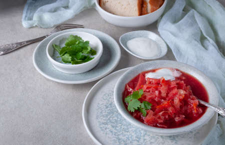 Red soup served with white bread. Tasty soup.の写真素材