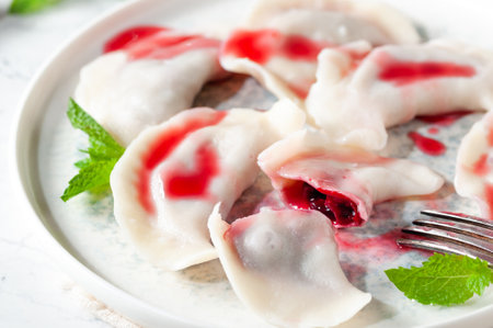 hot dessert. Cherry dumplings with sweet sauce. Vegetarian food.の写真素材