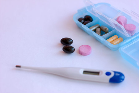 Medical thermometer and pills, coronavirus 2019-nCoV concept. coronavirus and pneumonia virus