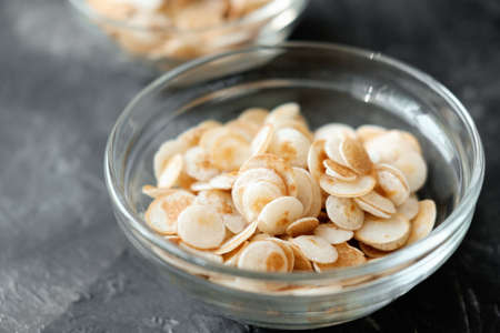 Mini cereal pancakes, Little dutch poffertjes. little round pancakes in transparent bowl on gray background. New trendy dessert in social media. Funny food for kidsの写真素材