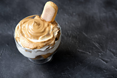 Iced frothy Dalgona Coffee tiramisu, a trendy fluffy creamy whipped coffee dessert. tiramisu with...