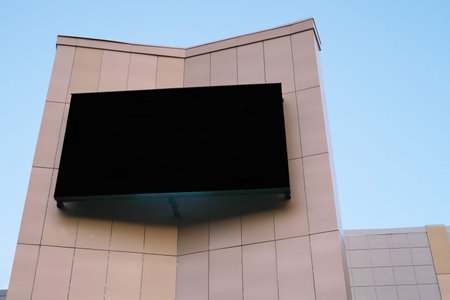giant outdoor screen for advertising and commercials. big empty black digital billboard screen on...
