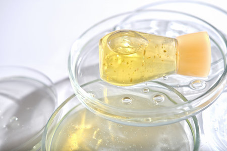 yellow bottle serum solution for sensitive skin on petri dishes