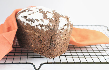 Homemade gluten free buckwheat bread with various seeds on a rack. fresh baked low carb bread...