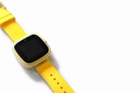yellow baby smart watch with GPS tracking on white background. kids safety and communication.mobile safety watch for children.の写真素材