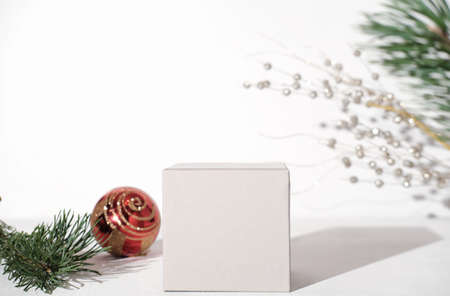 geometric podium for product presentation. pedestal or display for advertizing. variety of pine branch and christmas ball. Scene with geometrical forms. Empty showcase. eco friendly designの写真素材