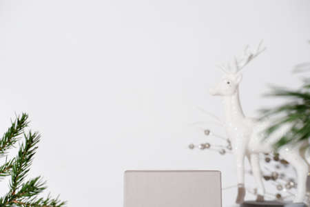 winter empty cube geometric podium with minimal christmas decor for holiday sale product placement. showcase for your design.の写真素材