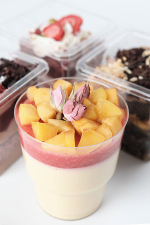 apple mousse with strawberry jam filling and apple slices decorated with rose buds. autumn comfort...