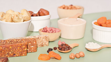Healthy lifestyle and raw vegan food concept. homemade energy bars and dried fruits and nuts.