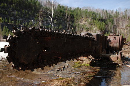 Old chain saw in the forest, spring timeの写真素材