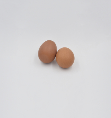 Two brown eggs together on the gray backgroundの写真素材
