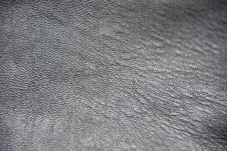 Close up photo of black leather with visible pattern of the textureの写真素材