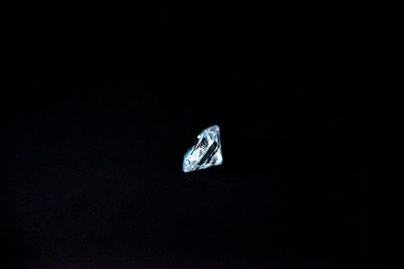 one diamond of classic shape on the black background
