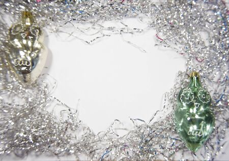Old christmas and new year toys made of glass on the white backgtound. Image with empty space for text as a concept of Christmas cards or invitations.の写真素材