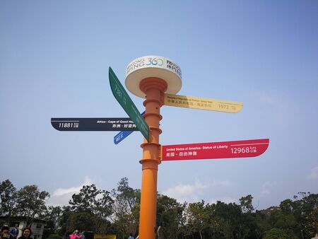17th of March 2018 road pole with distances and directions at the mountain near Tian Tan Buddhaのeditorial素材