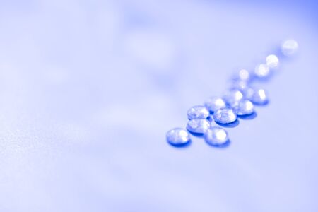 Blue isolated crystals on the plain background with the side light. Concept of fashion. selective focus, rainbowの写真素材