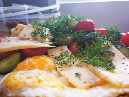 selective focus at the fresh breakfast with cheese and vegetablesの写真素材